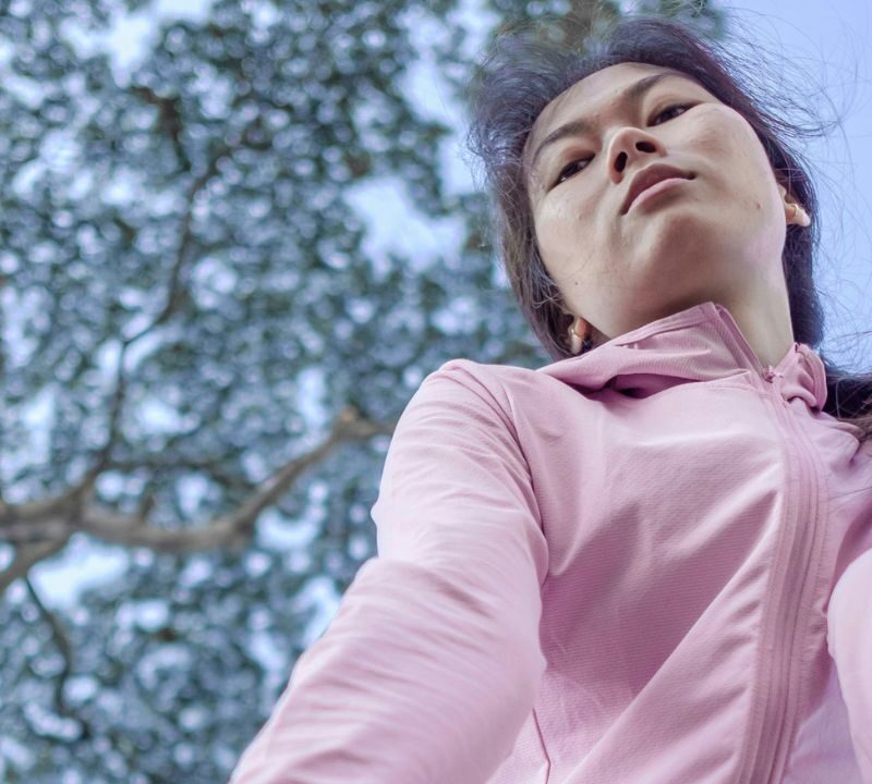 woman leaning over in work out clothes